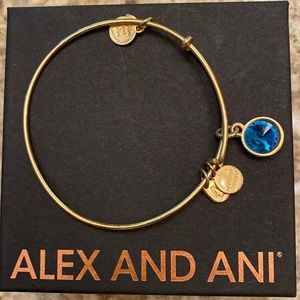 Alex and Ani gold bracelet with aqua blue stone